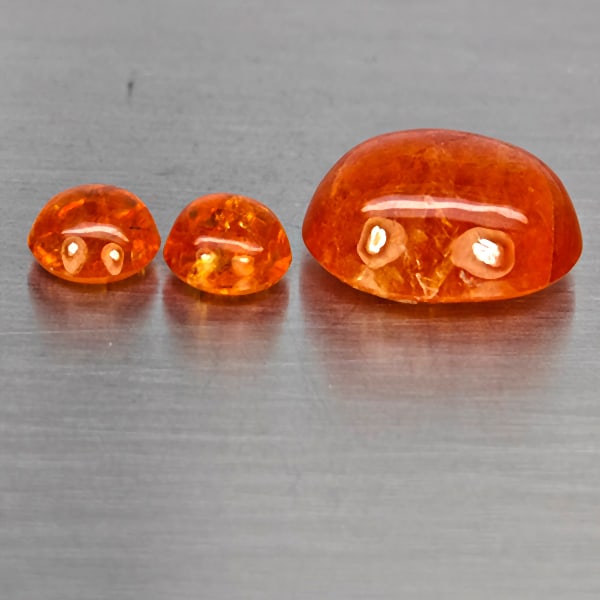 Natural Orangish Red Spessartine Garnet Gemstones 16.89 Ct. 3 Pcs. Mixed Cabochon Shape and Mixed: Product ID: 802937996 Product Name: Natural Garnet Weight: 16.89 CT. Size: 14.4 x 11.8 x 7.2 to 6.8 x 6.8 x 4.4 MM. Shape: Mixed Cabochon Color: Orangish Red Clarity:SI1 Luster: Good Gems Origin: Nami