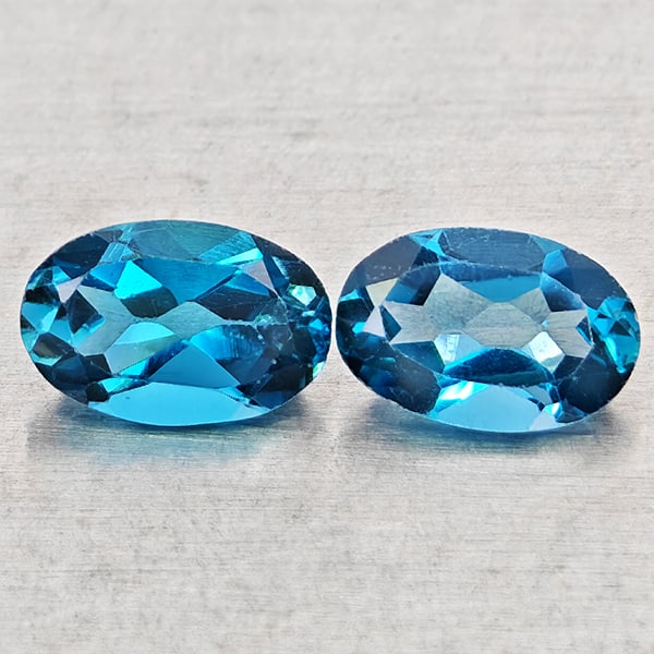 Natural London Blue Topaz Gemstones 1.10 Ct. 2 Pcs. Oval Shape 6 x 4 Mm.: Product ID: 807168451 Product Name: Natural Blue Topaz Weight: 1.10 CT. Size: 6 x 4 x 2.9 MM. Shape: Oval Shape Color: London Blue Clarity:VSI - SI1 Luster: Good Gems Origin: Brazil Treatment: Treated