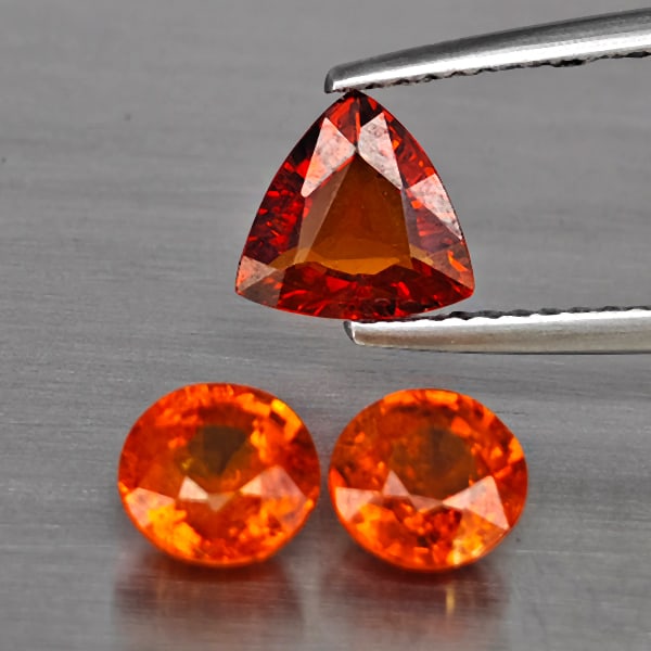 Natural Orangish Red Spessartine Garnet Gemstones 3.43 Ct. 3 Pcs. Mixed Shape and Mixed Size: Product ID: 802937923 Product Name: Natural Garnet Weight: 3.43 CT. Size: 7.1 x 7.1 x 3.3 to 6 x 6 x 3.8 MM. Shape: Mixed Shape Color: Orangish Red Clarity:SI1 Luster: Good Gems Origin: Namibia Treatm
