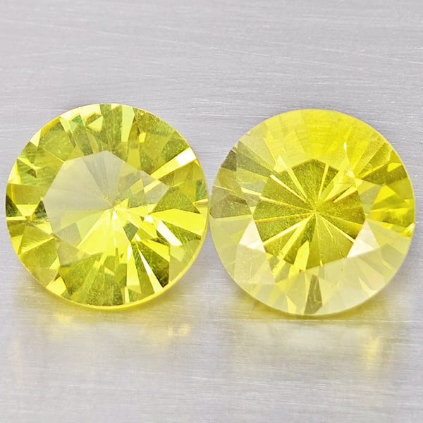 Natural Yellow Lemon Quartz Gemstones 3.64 Ct. 2 Pcs. Round Diamond Cut 8.2 Mm.: Product ID: 805530155 Product Name: Natural Quartz Weight: 3.64 CT. Size: 8.2 x 8.2 x 6.1 MM. Shape: Round Diamond Cut Color: Yellow Lemon Clarity:VSI Luster: Good Gems Origin: Brazil Treatment: Unhea