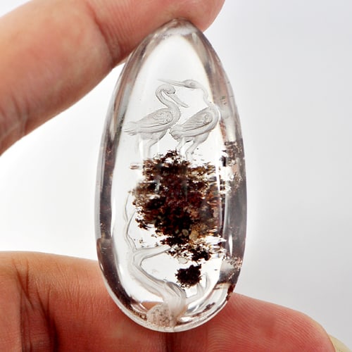 Natural Moss Quartz 125 Ct. Birds Carving Inner Pear Cabochon 49 x 23 Mm.: Product ID: 805527010 Product Name: Natural Quartz Weight: 125.00 CT. Size: 49 x 23 x 16 MM. Shape: Pear Cabochon Color: White Clarity:Semi - Transparent Luster: Good Gems Origin: Thailand Treatment: 