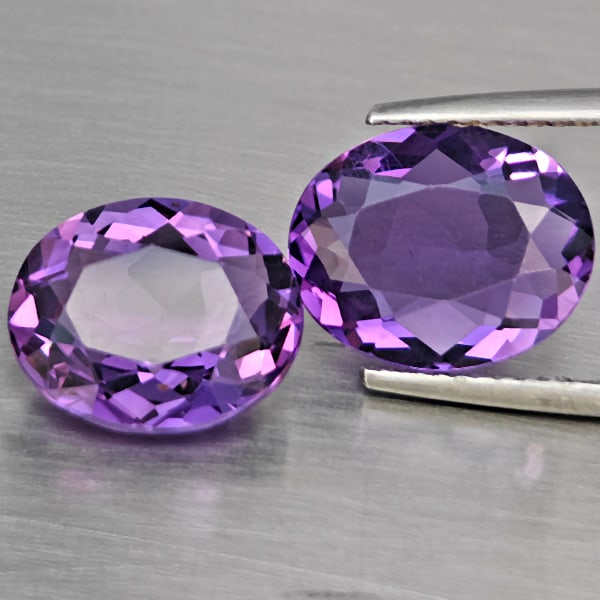 Natural Purple Amethyst Gemstones 6.22 Ct. 2 Pcs. Oval Shape 11.7 x 9.6 Mm.: Product ID: 800325592 Product Name: Natural Amethyst Weight: 6.22 CT. Size: 11.7 x 9.6 x 4.9 MM. Shape: Oval Color: Purple Clarity:VSI Luster: Good Gems Origin: Brazil Treatment: Unheated Crystal Stru