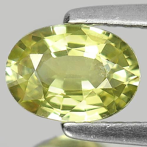 Natural Greenish Yellow Chrysoberyl Gemstones 0.98 Ct. Oval Shape 7 x 5 Mm.: Product ID: 801700969 Product Name: Natural Chrysoberyl Weight: 0.98 CT. Size: 7 x 5 x 3.2 MM. Shape: Oval Color: Yellow Clarity:VSI Luster: Good Gems Origin: Madagascar Treatment: Unheated Crystal St
