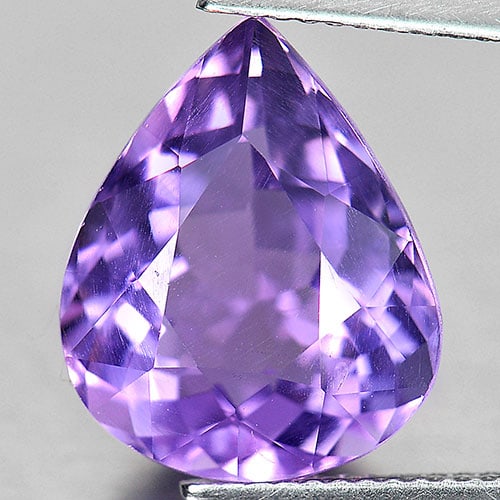 Natural Purple Amethyst Gemstones 7.24 Ct. Pear Shape 14.9 x 12.1 Mm.: Product ID: 800317719 Product Name: Natural Amethyst Weight: 7.24 CT. Size: 14.9 x 12.1 x 8 MM. Shape: Pear Color: Purple Clarity:VVS Luster: Very Good Gems Origin: Brazil Treatment: Treated Crystal S