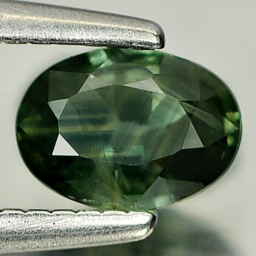Natural Green Sapphire Gemstones 0.44 Ct. Oval Shape 5.4 x 3.9 Mm.: Product ID: 806157871 Product Name: Natural Green Sapphire Weight: 0.44 CT. Size: 5.4 x 3.9 x 2.3 MM. Shape: Oval Color: Bluish Green Clarity:VSI Luster: Good Gems Origin: Thailand Treatment: Heated C