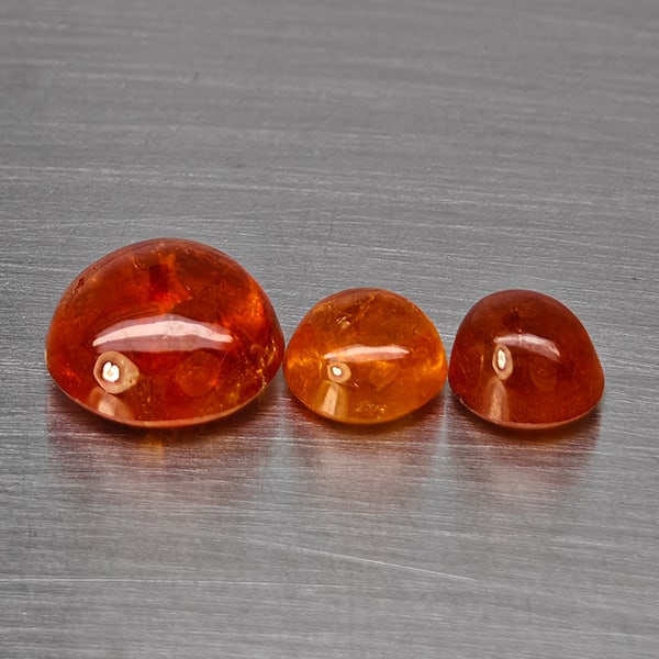 Natural Orangish Red Spessartine Garnet Gemstones 9.10 Ct. 3Pcs Mixed Cabochon Shape and Mixed Size: Product ID: 802938040 Product Name: Natural Garnet Weight: 9.10 CT. Size: 9.5 x 9.5 x 5.7 to 6.4 x 6.4 x 4.8 MM. Shape: Mixed Shape Color: Orangish Red Clarity:SI1 Luster: Good Gems Origin: Namibia Tr