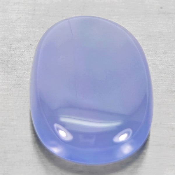 Natural Lavender Chalcedony Gemstones 34.44 Ct. Oval Cabochon Shape 27 x 18.5 Mm.: Product ID: 801502726 Product Name: Natural Weight: 34.44 CT. Size: 27 x 18.5 x 8.4 MM. Shape: Oval Cabochon Color: Lavender Clarity:Semi - Transparent Luster: Good Gems Origin: Russia Treatment: Unhe