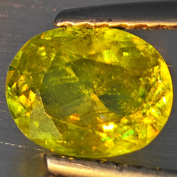 Natural Multi-Color Sphene Gemstones With Rainbow Spark 1.24 Ct. Oval Shape 7.5 x 6 Mm.: Product ID: 806509205 Product Name: Natural Sphene Weight: 1.24 CT. Size: 7.5 x 6 x 3.7 MM. Shape: Oval Shape Color: Multi-Color Clarity:SI1 Luster: Good Gems Origin: Madagascar Treatment: Unheated Cr