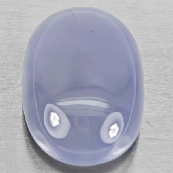 Natural Lavender Chalcedony Gemstone 52.45 Ct. Oval Cabochon Shape 30 x 20 Mm.: Product ID: 801502643 Product Name: Natural Weight: 52.45 CT. Size: 30 x 20 x 11.7 MM. Shape: Oval Cabochon Color: Lavender Clarity:Semi - Transparent Luster: Good Gems Origin: Russia Treatment: Unhea