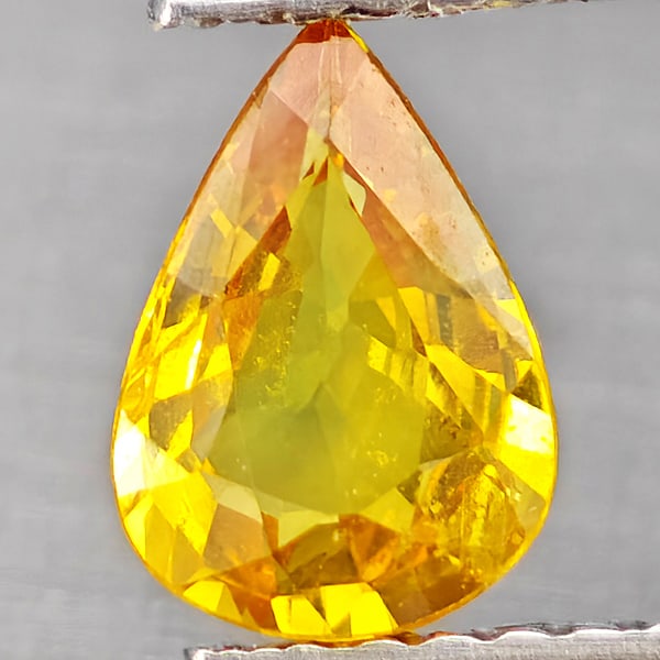 Natural Yellow Sapphire Gemstones 0.79 Ct. Pear Shape 7.4 x 5.3 Mm.: Product ID: 806162841 Product Name: Natural Yellow Sapphire Weight: 0.79 CT. Size: 7.4 x 5.3 x 2.8 MM. Shape: Pear Shape Color: Yellow Clarity:VSI Luster: Good Gems Origin: Thailand Treatment: Heated 