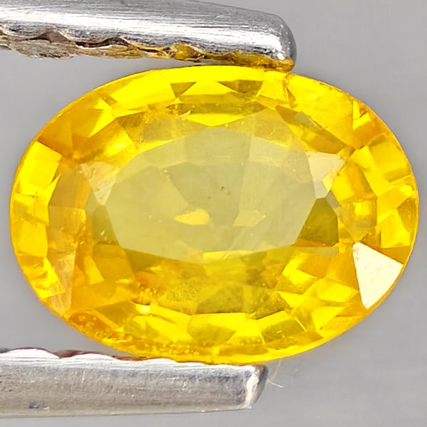 Natural Yellow Sapphire Gemstones 0.54 Ct. Oval Shape 5.3 x 4.1 Mm.: Product ID: 806162848 Product Name: Natural White Gold Weight: 0.54 CT. Size: 5.3 x 4.1 x 2.4 MM. Shape: Oval Shape Color: Yellow Clarity:VSI Luster: Good Gems Origin: Thailand Treatment: Heated Cryst