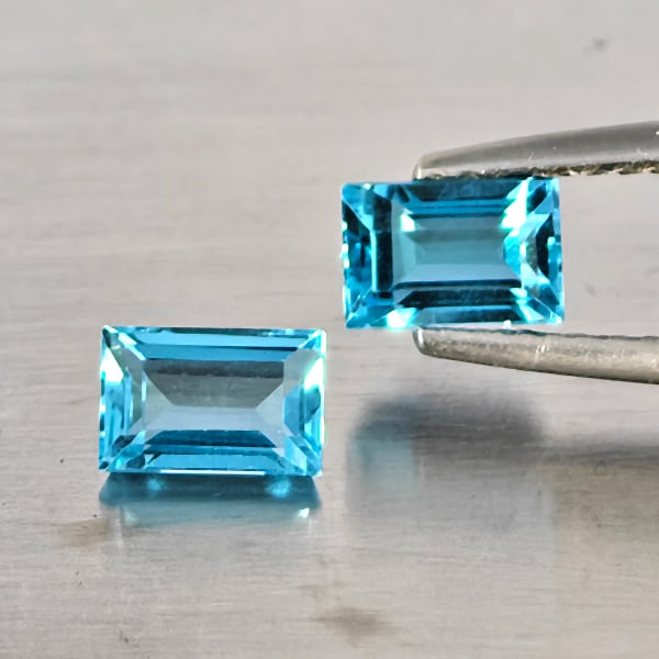 Natural Blue Topaz Gemstones 2.56 Ct. 2 Pcs. Baguette Shape 6.2 x 4.1 Mm.: Product ID: 807169126 Product Name: Natural Blue Topaz Weight: 2.56 CT. Size: 6.2 x 4.1 x 3 MM. Shape: Baguette Color: Blue Clarity:VSI - SI1 Luster: Good Gems Origin: Brazil Treatment: Treated Crysta