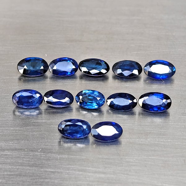 Natural Diffusion Deep Blue Sapphire Gemstones 3.56 Ct. 12 Pcs. Oval Shape and Mixed Size: Product ID: 806130650 Product Name: Natural Blue Sapphire Weight: 3.56 CT. Size: 5.2 x 3 x 2.8 to 5.1 x 3.3 x 2.2 MM. Shape: Oval Shape Color: Deep Blue Clarity:VSI - SI1 Luster: Good Gems Origin: Mad