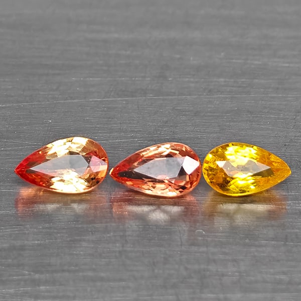 Natural Fancy Color Sapphire Gemstones 0.78 Ct. 3 Pcs. Pear Shape and Mixed Size: Product ID: 806130630 Product Name: Natural Fancy Color Sapphire Weight: 0.78 CT. Size: 5 x 3 x 2.2 to 5.2 x 3.2 x 2 MM. Shape: Pear Shape Color: Fancy Color Clarity:VSI - SI1 Luster: Good Gems Origin