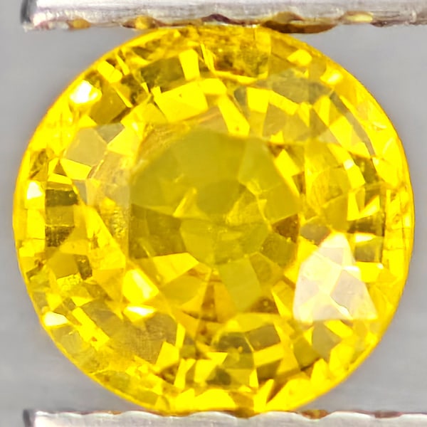Natural Yellow Sapphire Gemstones 0.61 Ct. Round Shape 4.9 Mm.: Product ID: 806162957 Product Name: Natural Yellow Sapphire Weight: 0.61 CT. Size: 4.9 x 4.9 x 3 MM. Shape: Round Shape Color: Yellow Clarity:VSI Luster: Good Gems Origin: Thailand Treatment: Heated C
