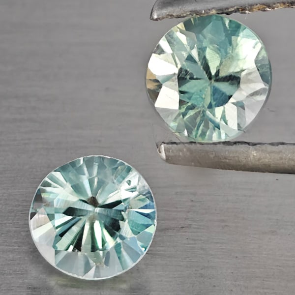 Natural Blue Zircon Gemstones 1.29 Ct. 2 Pcs Round Diamond Cut 4.7 Mm.: Product ID: 807743240 Product Name: Natural Zircon Weight: 1.29 CT. Size: 4.7 x 4.7 x 4.2 MM. Shape: Round Diamond Cut Color: Blue Clarity:SI1 Luster: Good Gems Origin: Cambodia Treatment: Heated Crys