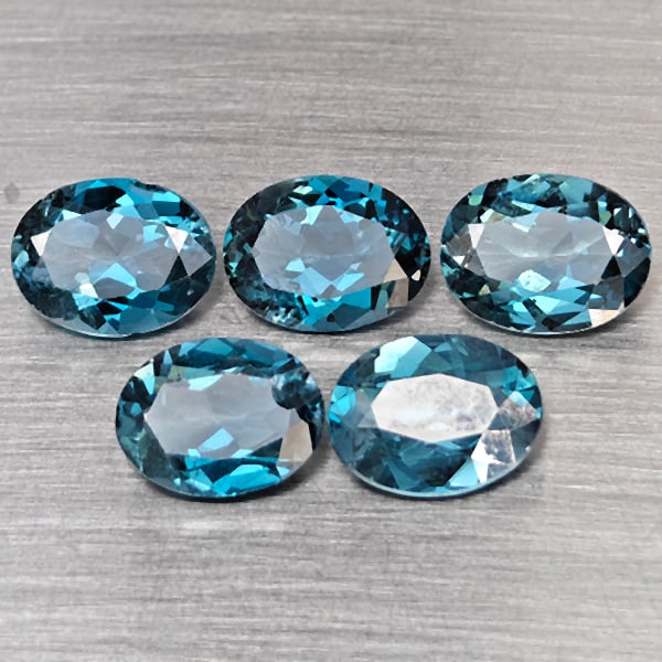 Natural London Blue Topaz Gemstones 9.25 Ct. 5 Pcs. Oval Shape 9 x 7 Mm.: Product ID: 807168952 Product Name: Natural Blue Topaz Weight: 9.25 CT. Size: 9 x 7 x 4.2 MM. Shape: Oval Color: London Blue Clarity:SI1 Luster: Good Gems Origin: Brazil Treatment: Treated Crystal Str