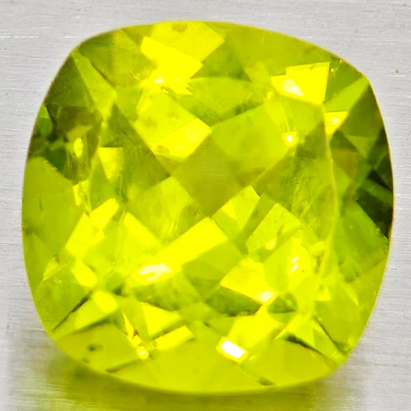 Natural Green Peridot Gemstones 1.63 Ct. Cushion Shape 7.1 Mm.: Product ID: 805317244 Product Name: Natural Peridot Weight: 1.63 CT. Size: 7.1 x 7.1 x 4.5 MM. Shape: Cushion Shape Color: Green Clarity:VSI - SI1 Luster: Good Gems Origin: Pakistan Treatment: Unheate
