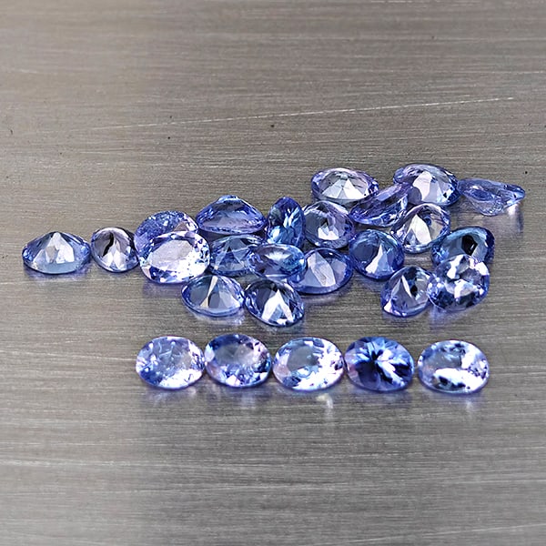Natural Violetish Blue Tanzanite Gemstones 4.24 Ct. 26 Pcs. Oval Shape 4 x 3 Mm.: Product ID: 807015119 Product Name: Natural Tanzanite Weight: 4.24 CT. Size: 4 x 3 x 1.8 MM. Shape: Oval Color: Violetish Blue Clarity:VSI Luster: Good Gems Origin: Tanzania Treatment: Heated Crystal 