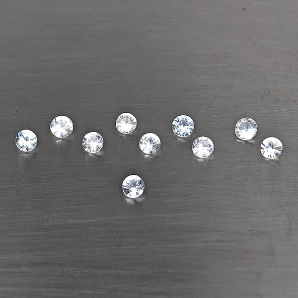 Natural White Sapphire Gemstones 0.77 Ct. 10 Pcs. Round Shape 2.3 Mm.: Product ID: 806130644 Product Name: Natural White Sapphire Weight: 0.77 CT. Size: 2.3 x 2.3 x 1.5 MM. Shape: Round Shape Color: White Clarity:VSI Luster: Good Gems Origin: Sri - Lanka Treatment: Heate