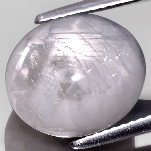 Natural Gray Star Sapphire Gemstones 10.76 Ct. Oval Cabochon Shape 13.1 x 11.4 Mm.: Product ID: 806149390 Product Name: Natural Star Sapphire Weight: 10.76 CT. Size: 13.1 x 11.4 x 6.1 MM. Shape: Oval Cabochon Color: Gray Clarity:Opaque Luster: Good 6 Rays Star Gems Origin: Thailand T