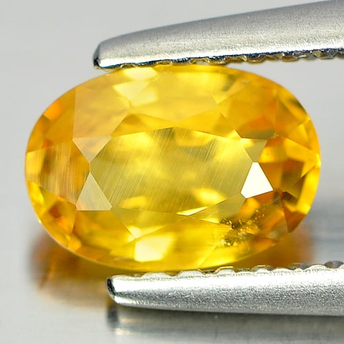 Natural Yellow Sapphire Gemstones 1.08 Ct. Oval Shape 7 x 4.9 Mm.: Product ID: 806150931 Product Name: Natural Yellow Sapphire Weight: 1.08 CT. Size: 7 x 4.9 x 3.3 MM. Shape: Oval Color: Yellow Clarity:SI1 Luster: Good Gems Origin: Thailand Treatment: Heated Crystal 