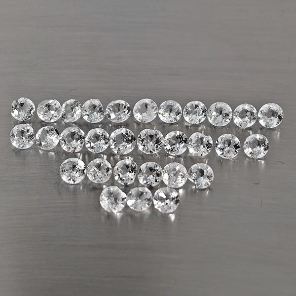 Natural White Topaz Gemstones 8.59 Ct. 30 Pcs. Round Shape 4.1 Mm.: Product ID: 807169119 Product Name: Natural Topaz Weight: 8.59 CT. Size: 4.1 x 4.1 x 2.6 MM. Shape: Round Shape Color: White Clarity:VSI - SI1 Luster: Good Gems Origin: Brazil Treatment: Treated Cryst
