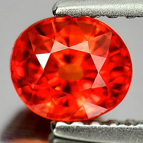 Natural Orange Red Songea Sapphire Gemstones 1.03 Ct. Oval Shape 5.9 x 5.1 Mm.: Product ID: 806153607 Product Name: Natural Red Sapphire Weight: 1.03 CT. Size: 5.9 x 5.1 x 4 MM. Shape: Oval Color: Orange Red Clarity:VVS Luster: Good Gems Origin: Tanzania Treatment: Heated Crystal