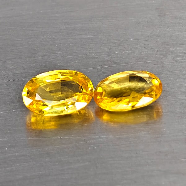 Natural Yellow Songea Sapphire Gemstones 1.92 Ct. 2 Pcs. Oval Shape 5 x 4 Mm.: Product ID: 806130569 Product Name: Natural Yellow Sapphire Weight: 1.92 CT. Size: 5 x 4 x 2.9 MM. Shape: Pear Color: Orangish Red Clarity:VVS Luster: Good Gems Origin: Tanzania Treatment: Heated Crys