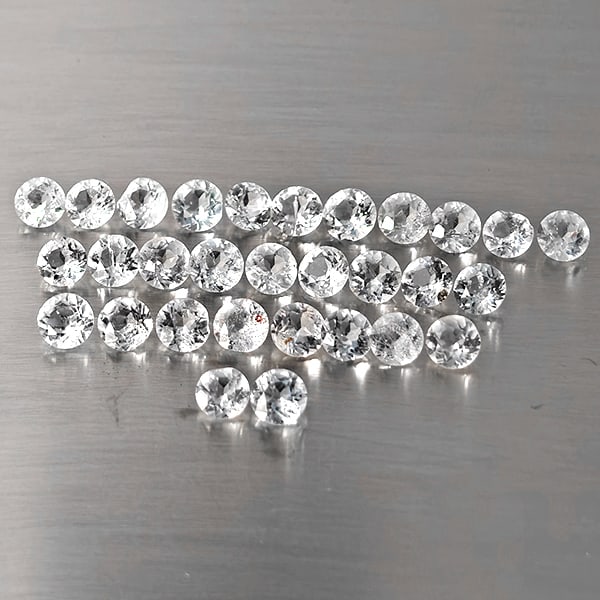 Natural White Topaz Gemstones 8.75 Ct. 30 Pcs. Round Shape and Mixed Size: Product ID: 807169117 Product Name: Natural Topaz Weight: 8.75 CT. Size: 4 x 4 x 2.8 to 3.9 x 3.9 x 2.6 MM. Shape: Round Shape Color: White Clarity:VSI - SI1 Luster: Good Gems Origin: Brazil Treatment