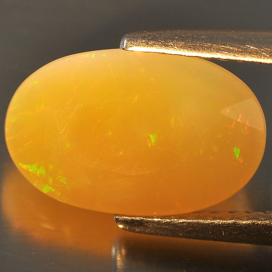 Natural Multi Color Opal Gemstones 2.63 Ct. Oval Shape 12.8 x 8.2 Mm.: Product ID: 818708246 Product Name: Natural Opal Weight: 2.63 CT. Size: 12.8 x 8.2 x 5.8 MM. Shape: Oval Color: Multi Color Clarity:Semi - Transparent Luster: Good Gems Origin: Ethiopia Treatment: Unh