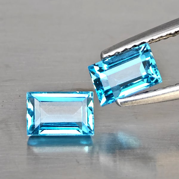 Natural Blue Topaz Gemstones 2.79 Ct. 2 Pcs. Baguette Shape 4.2 x 6.1 Mm.: Product ID: 807169127 Product Name: Natural Blue Topaz Weight: 2.79 CT. Size: 4.2 x 6.1 x 3.5 MM. Shape: Baguette Color: Blue Clarity:VSI - SI1 Luster: Good Gems Origin: Brazil Treatment: Treated Crys