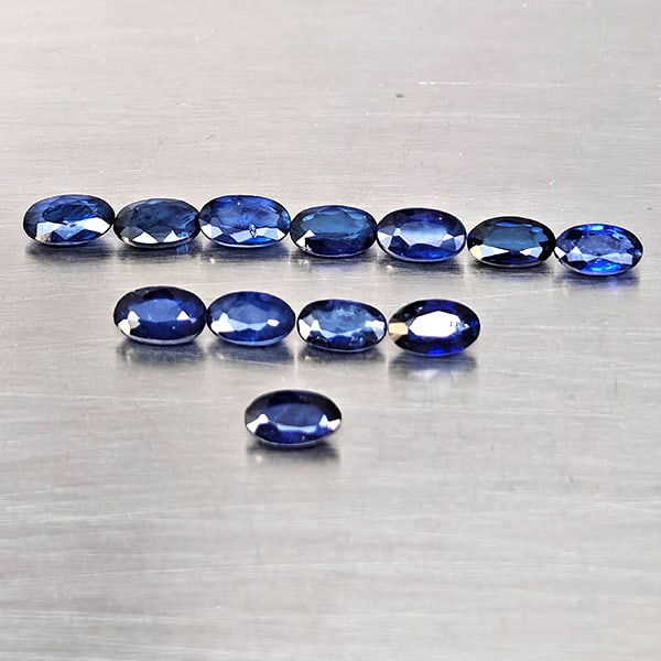 Natural Diffusion Deep Blue Sapphire Gemstones 3.22 Ct. 12 Pcs. Oval Shape 5.2 x 3.2 Mm.: Product ID: 806130647 Product Name: Natural Blue Sapphire Weight: 3.22 CT. Size: 5.2 x 3.2 x 2 MM. Shape: Oval Shape Color: Deep Blue Clarity:VSI - SI1 Luster: Good Gems Origin: Madagascar Treatment: 