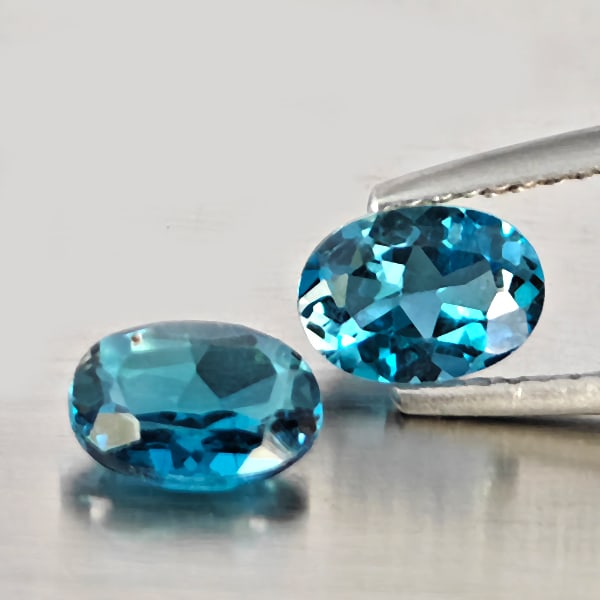 Natural London Blue Topaz Gemstones 2.07 Ct. 2 Pcs. Oval Shape 7.2 x 5.3 Mm.: Product ID: 807169112 Product Name: Natural Blue Topaz Weight: 2.07 CT. Size: 7.2 x 5.3 x 3 MM. Shape: Oval Shape Color: London Blue Clarity:VSI - SI1 Luster: Good Gems Origin: Brazil Treatment: Treat