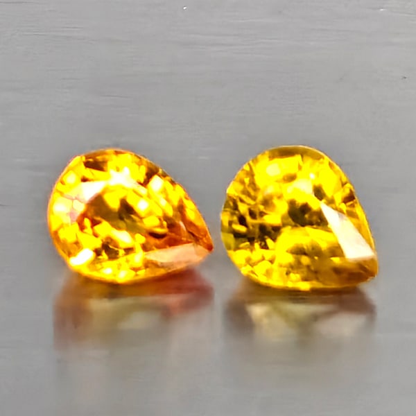 Natural Yellow Songea Sapphire Gemstones 1.46 Ct. 2 Pcs. Pear Shape 4.9 x 4 Mm.: Product ID: 806130576 Product Name: Natural Yellow Sapphire Weight: 1.46 CT. Size: 4.9 x 4 x 2.5 MM. Shape: Pear Color: Orangish Red Clarity:VVS Luster: Good Gems Origin: Tanzania Treatment: Heated Cr