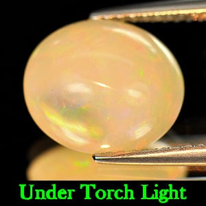 Natural Multi-Color Play Of Colour Opal Gemstones 3.25 Ct. Oval Cabochon Shape 11.2 x 9.6 Mm.: Product ID: 818710152 Product Name: Natural Opal Weight: 3.25 CT. Size: 11.2 x 9.6 x 5.9 MM. Shape: Oval Cabochon Color: Multi Color Clarity:Semi - Transparent Luster: Good Gems Origin: Ethiopia Treat