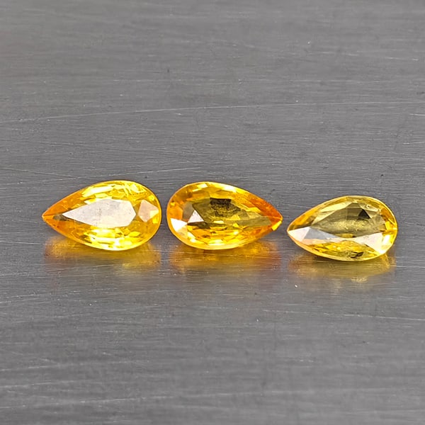 Natural Fancy Color Sapphire Gemstones 0.70 Ct. 3 Pcs. Pear Shape 5.2 x 3 Mm.: Product ID: 806130625 Product Name: Natural Fancy Color Sapphire Weight: 0.70 CT. Size: 5.2 x 3 x 2 MM. Shape: Pear Shape Color: Fancy Color Clarity:VSI - SI1 Luster: Good Gems Origin: Tanzania Treatm