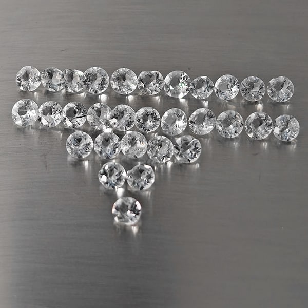Natural White Topaz Gemstones 8.41 Ct. 30 Pcs. Round Shape 4 Mm.: Product ID: 807169118 Product Name: Natural Topaz Weight: 8.41 CT. Size: 4 x 4 x 2.5 MM. Shape: Round Shape Color: White Clarity:VSI - SI1 Luster: Good Gems Origin: Brazil Treatment: Treated Crystal S