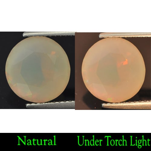 Natural Multi Color Opal Gemstones 3.16 Ct. Round Shape 10.5 Mm.: Product ID: 818707344 Product Name: Natural Opal Weight: 3.16 CT. Size: 10.5 x 10.5 x 7.5 MM. Shape: Round Color: Multi Color Clarity:Semi - Transparent Luster: Good Gems Origin: Ethiopia Treatment: U