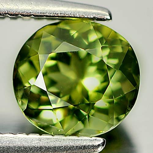 Natural Yellowish Green Tourmaline Gemstones 0.89 Ct. Oval Shape 6.1 x 5.7 Mm.: Product ID: 807246043 Product Name: Natural Tourmaline Weight: 0.89 CT. Size: 6.1 x 5.7 x 4.1 MM. Shape: Oval Color: Yellowish Green Clarity:VSI Luster: Good Gems Origin: Nigeria Treatment: Unheated C