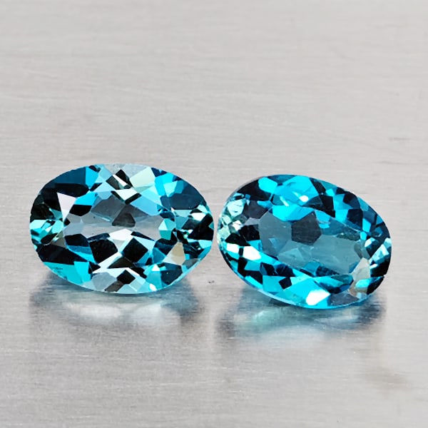 Natural London Blue Topaz Gemstones 1.09 Ct. 2 Pcs. Oval Shape 7.2 x 5.1 Mm.: Product ID: 807169105 Product Name: Natural Blue Topaz Weight: 1.09 CT. Size: 7.2 x 5.1 x 3.5 MM. Shape: Oval Shape Color: London Blue Clarity:VSI - SI1 Luster: Good Gems Origin: Brazil Treatment: Tre