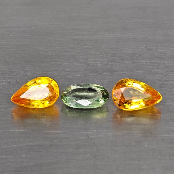 Natural Fancy Color Sapphire Gemstones 0.92 Ct. 3 Pcs. Mixed Shape And Mixed Size: Product ID: 806130626 Product Name: Natural Fancy Color Sapphire Weight: 0.92 CT. Size: 5.2 x 3.3 x 1.8 to 5.2 x 3 x 1.6 MM. Shape: Mixed Shape Color: Fancy Color Clarity:VSI - SI1 Luster: Good Gems O