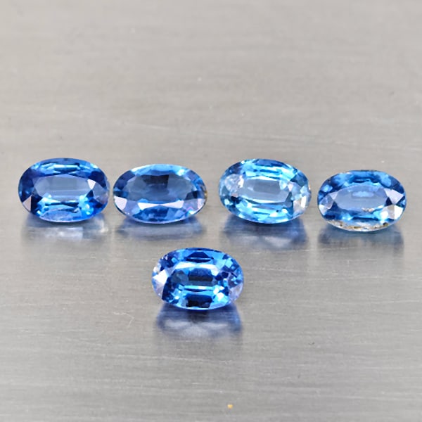 Natural Blue kyanite Gemstones 3.14 Ct. 5 Pcs. Oval Shape and Mixed Size: Product ID: 804204436 Product Name: Natural Kyanite Weight: 3.17 CT. Size: 6.4 x 4.3 x 2.3 to 6 x 4 x 3.2 MM. Shape: Oval Shape Color: Blue Clarity:VSI - SI1 Luster: Good Gems Origin: Sri - Lanka Trea