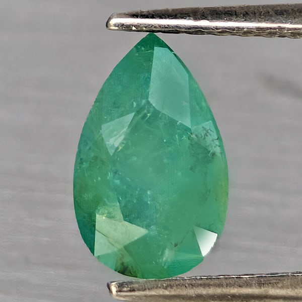 Natural Green Blueish Grandidierite Gemstones 1.45 Ct. Pear Shape 8.7 x 5.5 Mm.: Product ID: 803100097 Product Name: Natural Tsavorite Weight: 1.45 CT. Size: 8.7 x 5.5 x 4.5 MM. Shape: Pear Color: Green Blueish Clarity:SI1 Luster: Good Gems Origin: Madagascar Treatment: Unheated C