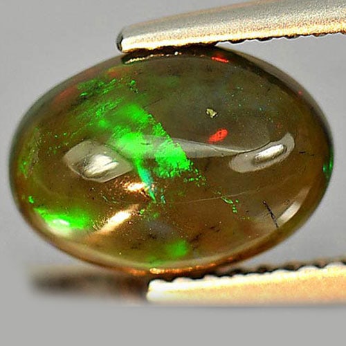 Natural Multi-Color Opal Gemstones 1.41 Ct. Oval Cabochon Shape 10.1 x 7.2 Mm.: Product ID: 818724493 Product Name: Natural Opal Weight: 1.41 CT. Size: 10.1 x 7.2 x 4.2 MM. Shape: Oval Cabochon Color: Multi-Color Clarity:Semi - Transparent Luster: Iridescent Gems Origin: Ethiopia