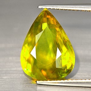 Natural Intense Green Sphene Gemstones With Rainbow Spark 8.90 Ct. Pear Shape 16 x 12 Mm.: Product ID: 806507099 Product Name: Natural Sphene Weight: 8.96 CT. Size: 16 x 12 x 6.2 MM. Shape: Pear Color: Intense Green With Rainbow Spark Clarity:SI Luster: Adamantine Gems Origin: Madagascar Tr