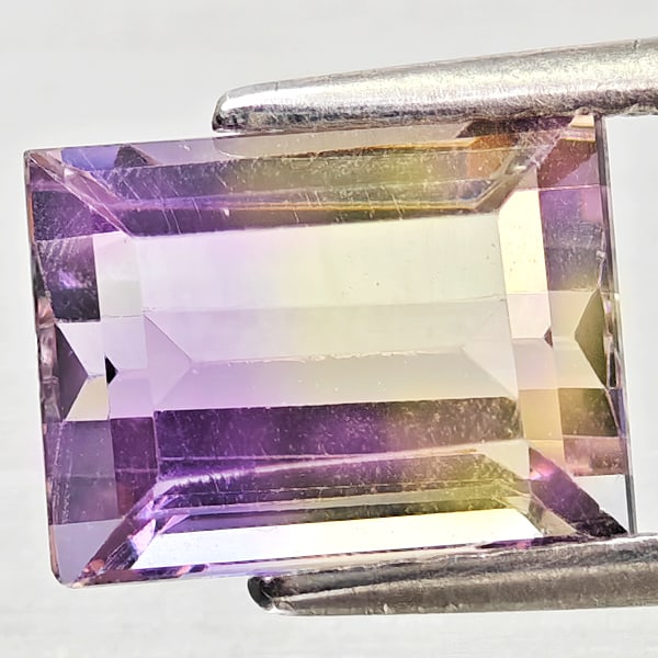Natural Bi Color Ametrine Gemstones 2.65 Ct. Octagon Shape 9.1 x 6.8 Mm.: Product ID: 800408358 Product Name: Natural Ametrine Weight: 2.65 CT. Size: 9.1 x 6.8 x 5.5 MM. Shape: Octagon Color: Bi Color Clarity:VSI - SI1 Luster: Good Gems Origin: Bolivia Treatment: Unheated C
