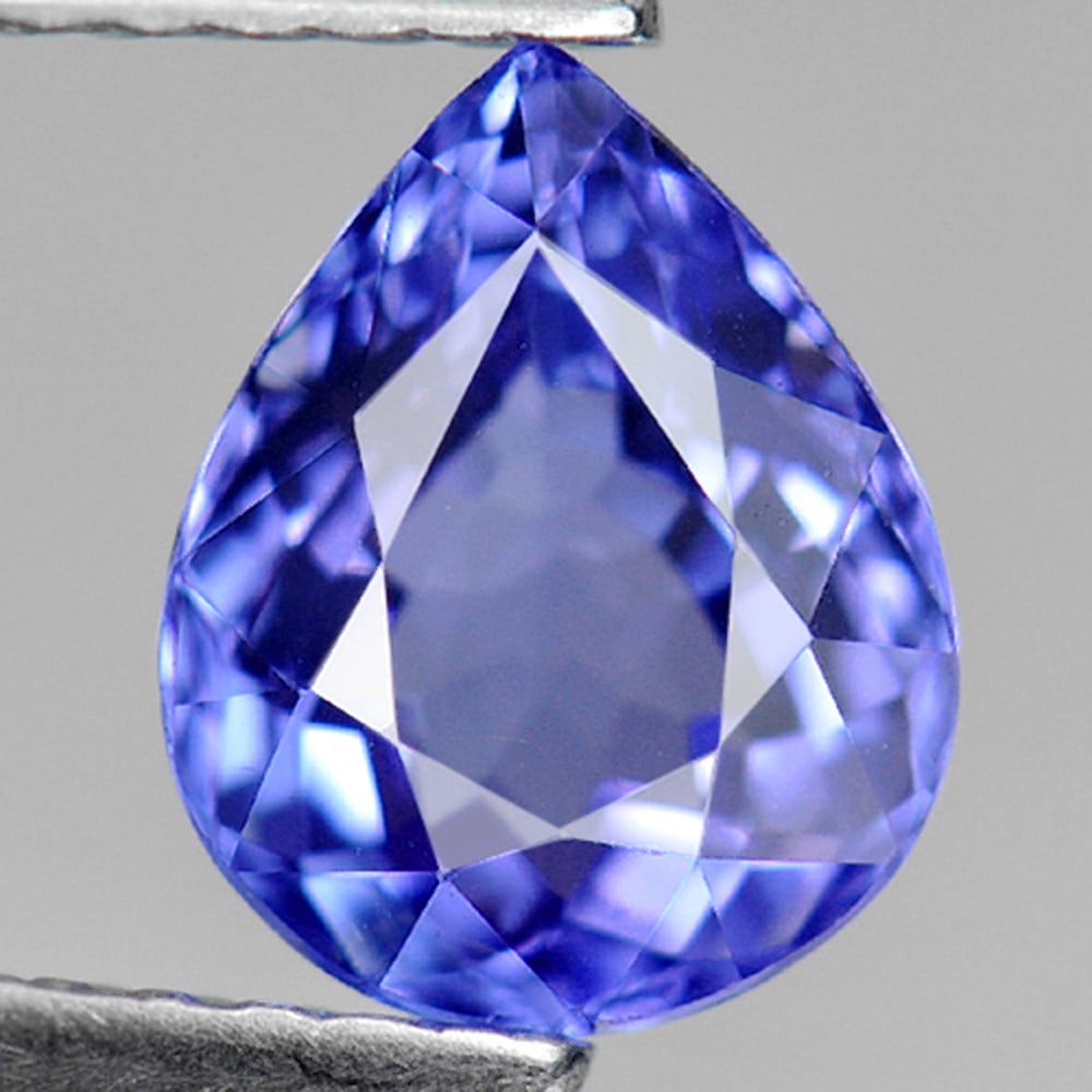 Natural Blue Tanzanite Gemstones 1.48 Ct. Pear Shape 8.1 x 6.4 Mm.: Product ID: 807006338 Product Name: Natural Tanzanite Weight: 1.48 CT. Size: 8.1 x 6.4 x 4.3 MM. Shape: Pear Color: Violetish Blue Clarity:VVS Luster: Good Gems Origin: Tanzania Treatment: Heated Crys