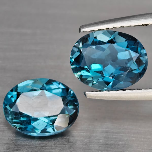 Natural London Blue Topaz Gemstones 5.16 Ct. 2 Pcs. Oval Shape 9.5 x 8 Mm.: Product ID: 807168947 Product Name: Natural Blue Topaz Weight: 5.16 CT. Size: 9.5 x 8 x 5.1 MM. Shape: Oval Color: London Blue Clarity:SI1 Luster: Good Gems Origin: Brazil Treatment: Treated Crystal S