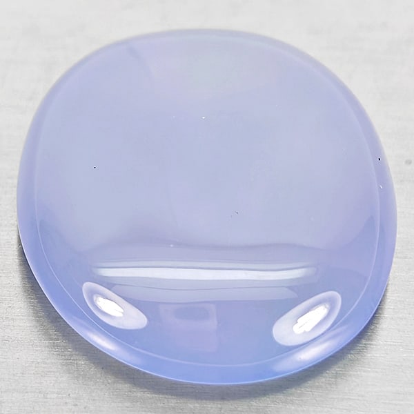 Natural Lavender Chalcedony Gemstones 25.46 Ct. Oval Cabochon Shape 22 x 18 Mm.: Product ID: 801502733 Product Name: Natural Weight: 25.46 CT. Size: 22 x 18 x 8.1 MM. Shape: Oval Cabochon Color: Lavender Clarity:Semi - Transparent Luster: Good Gems Origin: Russia Treatment: Unheat